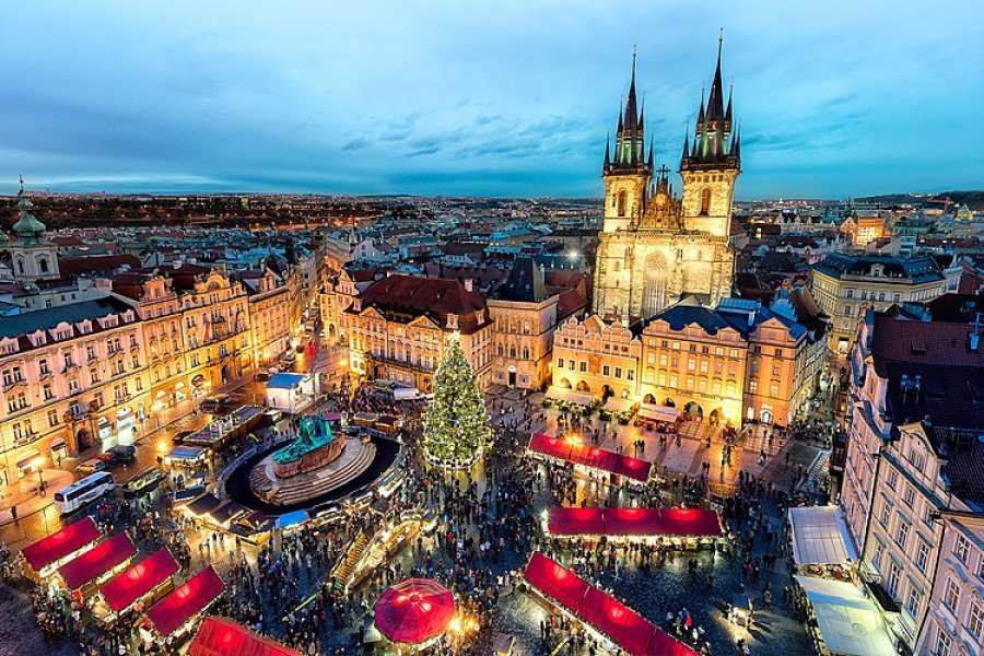 Prague Old Town Square Christmas market with illuminated Christmas tree at dusk – Prague