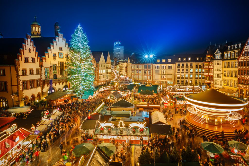 Krakow – Krakow Main Market Square Christmas market with the Cloth Hall and St Mary's Basilica at dusk